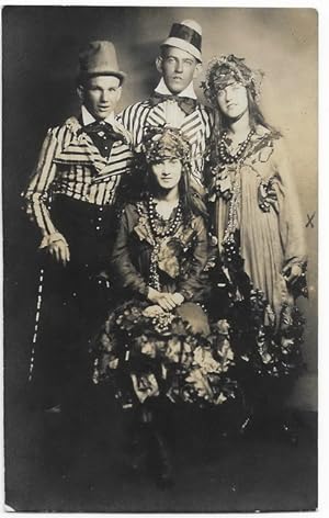 RPPC of two young women and two young men dressed up for Halloween in White City, Kansas