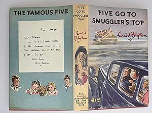 Five go to smuggler's top : another adventure of the four children and Timmy the dog