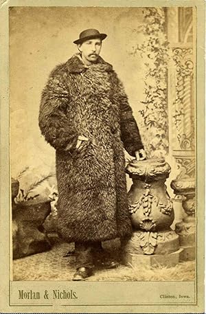 MAN IN FUR COAT [photograph].