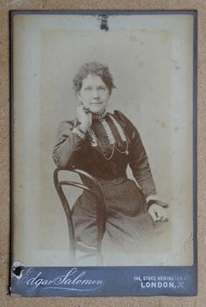 Cabinet Photograph: A Studio Portrait of a Seated Woman.