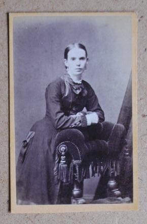 Carte De Visite Photograph: Portrait of a Seated Young Woman, Leaning on the Back of a Chair.