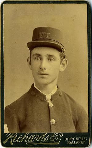 Carte de visite of young Australian man in uniform, with initials E. T. on his cap, possibly Elec...