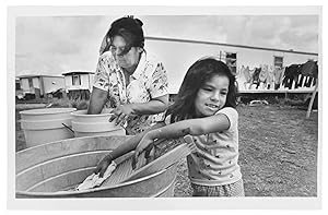 Maria Guadalupe Martinez and Mother Eriverta Martinez Do Their Wash Outside Their Trailer at Ever...