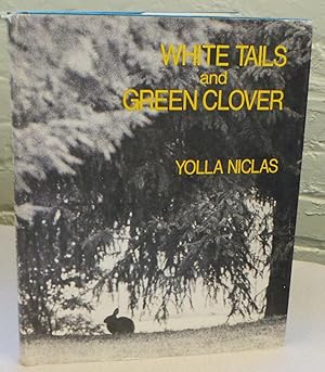 White tails and green clover