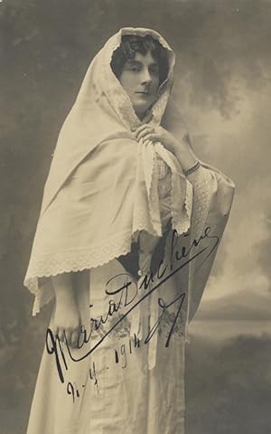 Three-quarter length postcard photograph of the French contralto in role portrait. Signed in full...