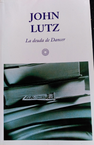 LA DEUDA DE DANCER. - LUTZ, John.