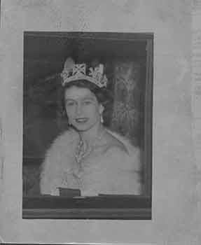 After the ceremony. Queen Elizabeth wearing a tiara of diamonds and pearls, a white gown and a white ermine wrap, pictured en route back to Buckingha