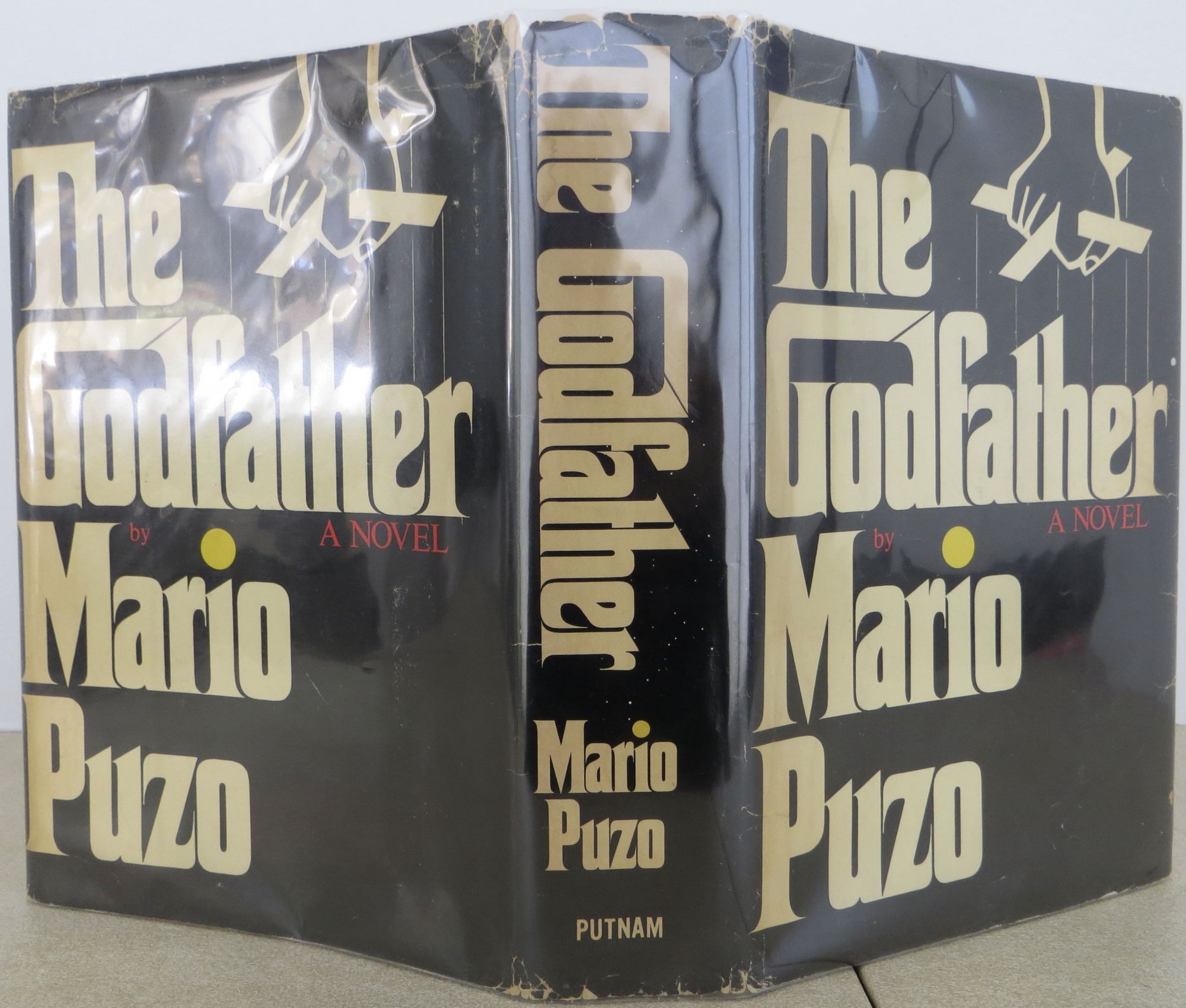 The Godfather de Puzo, Mario Near Fine Hardcover (1969) 1st Edition. Bookbid