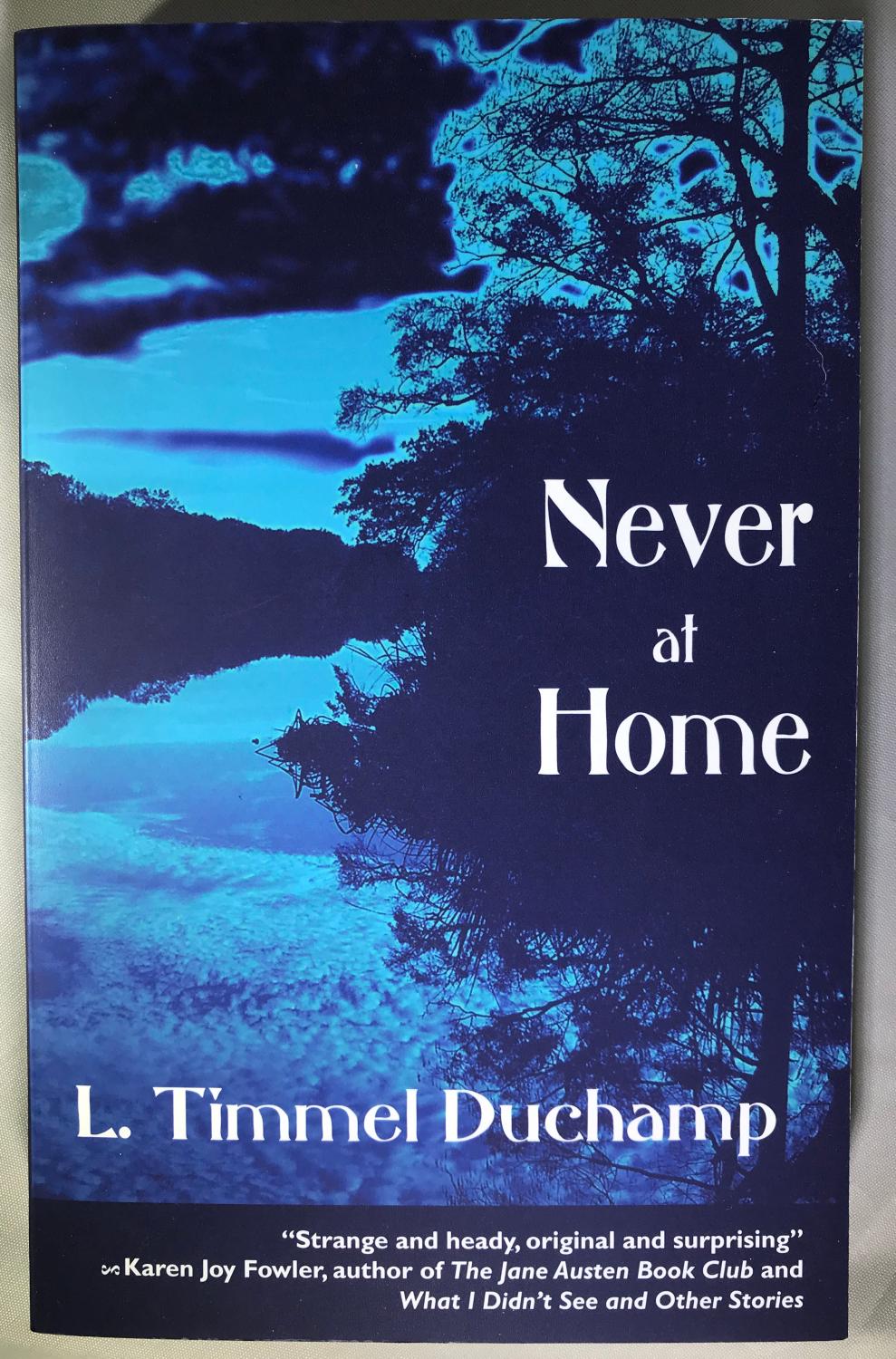 Never At Home [SIGNED] - L. Timmel Duchamp