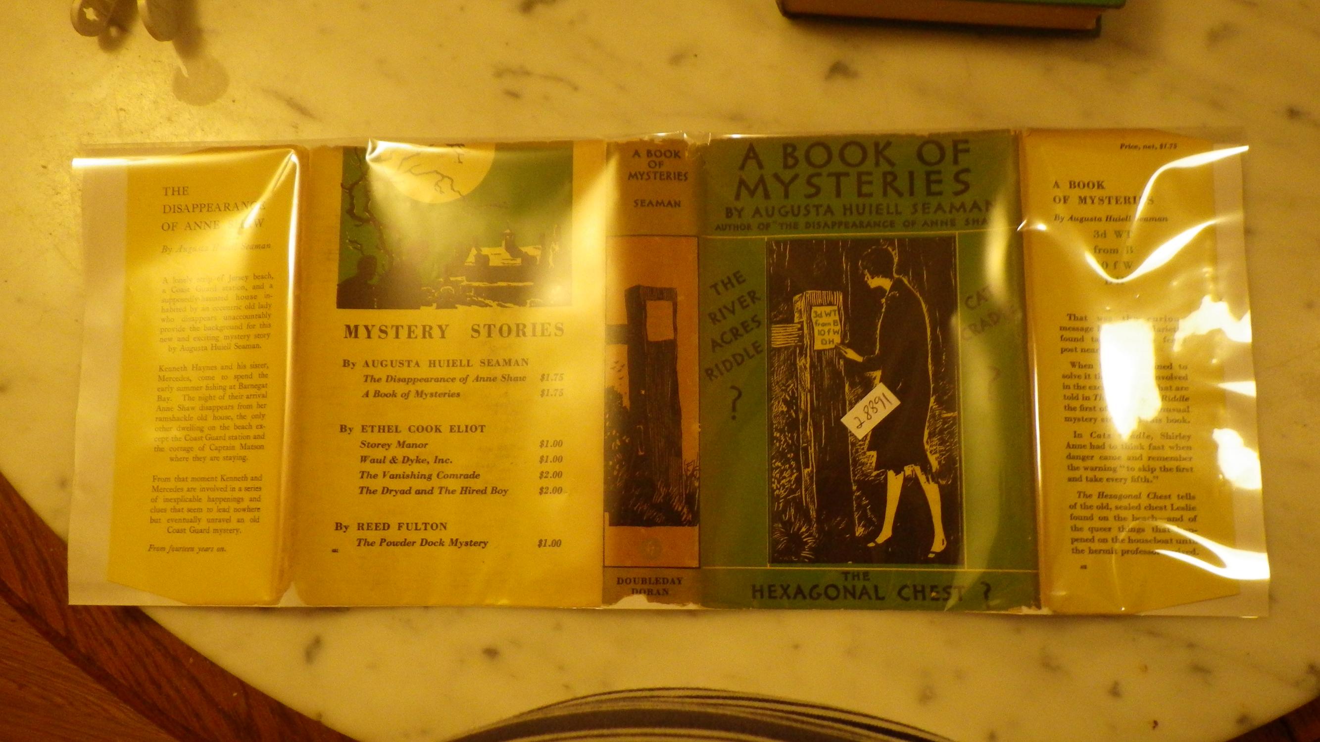A BOOK OF MYSTERIES, in Green DJ of Girl By Fencepost reading Clue, Includes the long title story, 'Cat's Cradle' and 'The Hexagonal Chest, WHICH TEL
