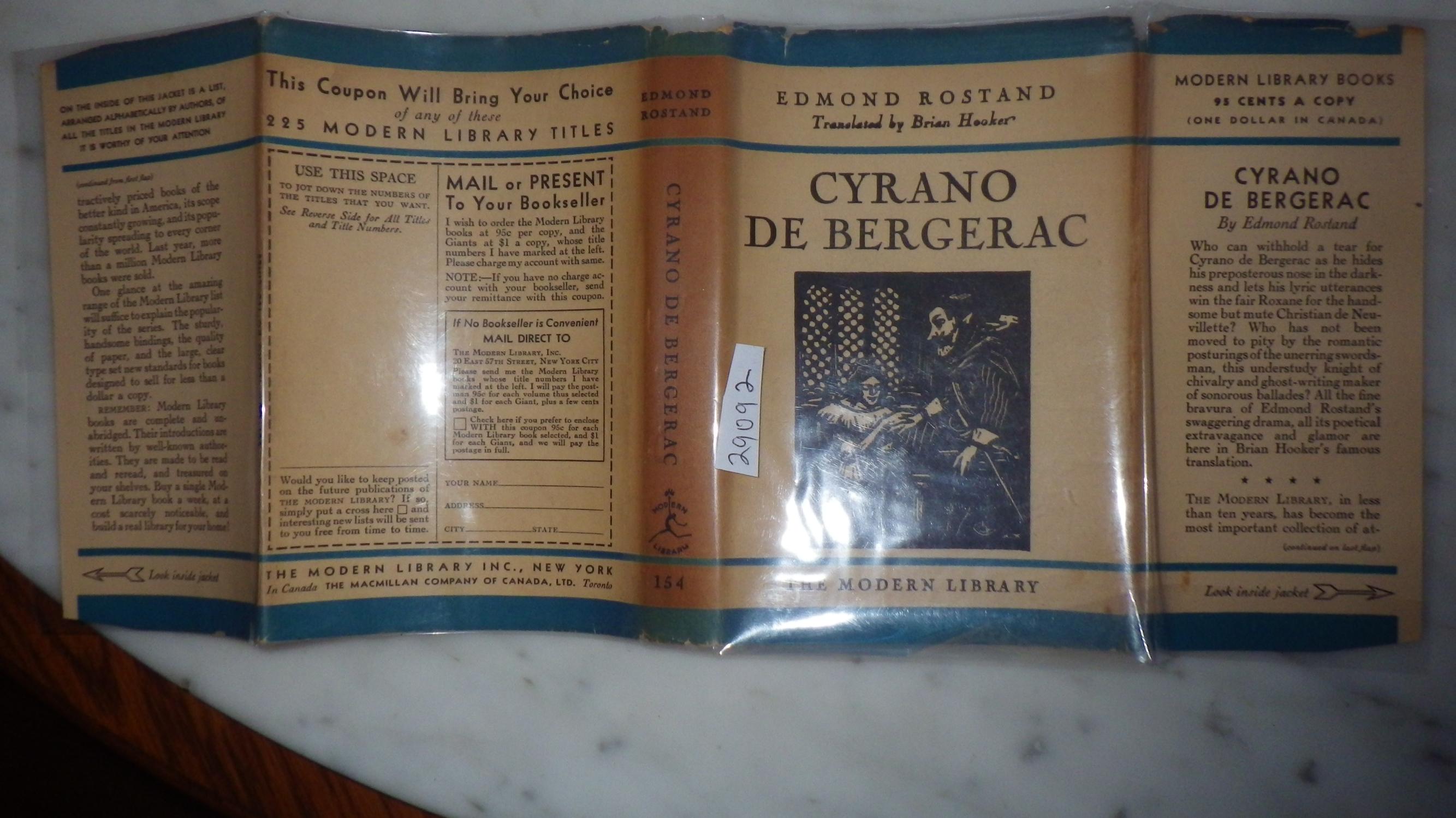 Cyrano De Bergerac, DJ BLUE WITH ILLUSTRATION OF CYRANO in B/W in Chair & Woman Kneeling ON FRONT in B/W, 1929, STATED 1ST Modern Library EDITION #15