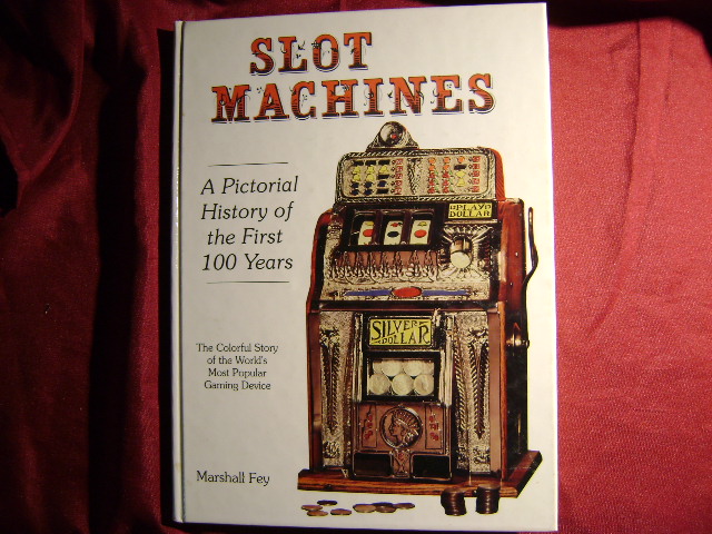 Slot Machines. Signed by the author. A Pictorial History of the First 100 Years of the World's Most Popular Coin-Operated Gaming Device. - Fey, Marshall.
