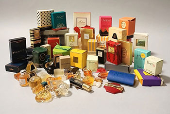 A collection of miniature perfume bottles with perfume and boxes from Nina  Ricci, Chanel, Guerlain, Carolina Herrera et al. by Ricci, Nina; Chanel;  Guerlain; Carolina Herrera: Manuscript / Paper Collectible