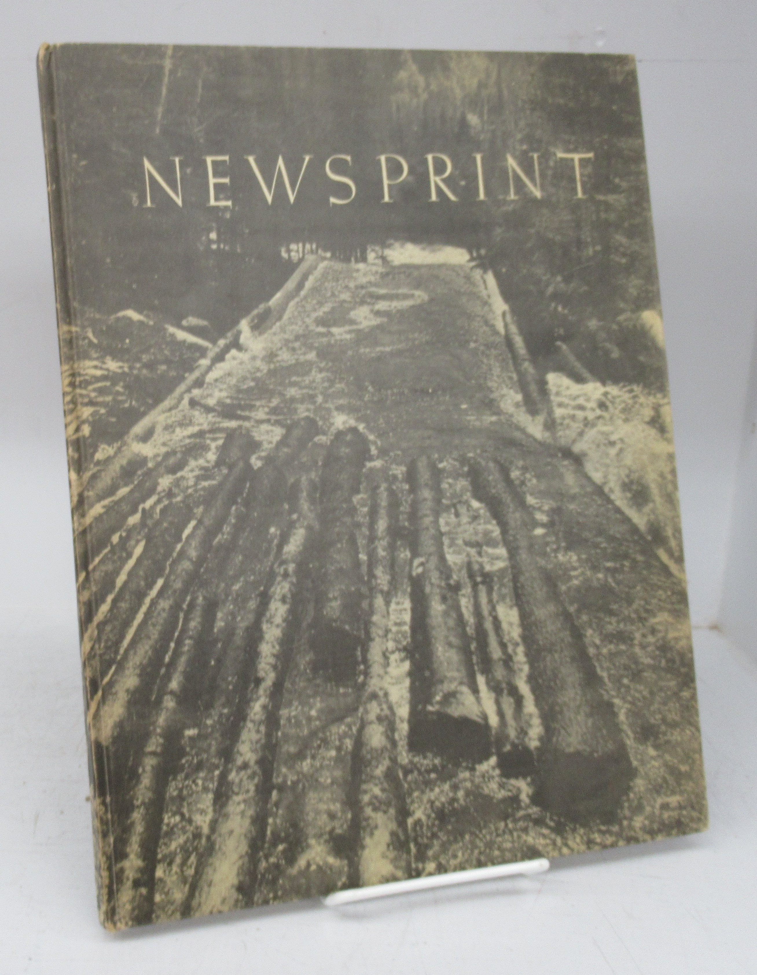 Newsprint: A book of pictures illustrating the operations in the  manufacture of paper on which to print the world's news by International  Paper Sales Company, Inc.: Near fine Hardcover (1939)