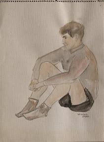 Portrait of a young man sitting.