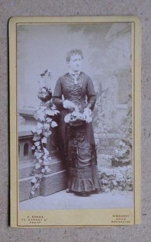 Seller image for Carte De Visite Photograph: Portrait of a Young Woman with a Basket of Flowers. for sale by N. G. Lawrie Books
