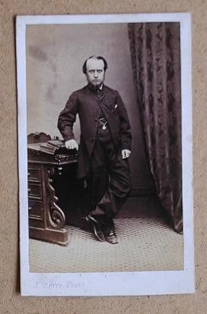 Seller image for Carte De Visite Photograph: Portrait of a Man Standing Beside a Desk. for sale by N. G. Lawrie Books
