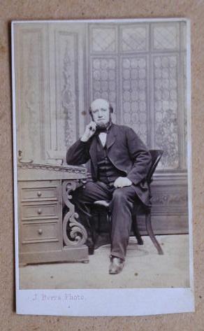 Seller image for Carte De Visite Photograph: Portrait of an Old Gentleman Seated at a Desk. for sale by N. G. Lawrie Books