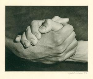 [Black and white photograph of clasped hands].