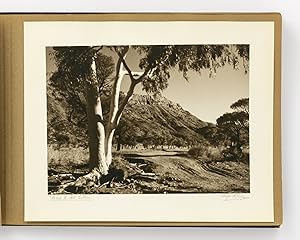 An album of 25 bromoil prints of Central Australia, individually captioned and signed by the phot...
