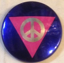 [Pinback button with peace sign inside a pink triangle]