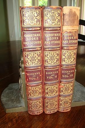 Imagen del vendedor de Christmas Books and Stories in 3 volumes - set ; A Christmas Carol , the Chimes , The Cricket on the Hearth , A Message From The Sea , Battle of Life , That Haunted Man, and the Ghost's Bargain , The Perils of Certain English Prisoners , Going into Society , The Haunted House , Tom Tiddler's Ground , Somebody's Luggage, Mrs. Lirriper's Lodgings , Mrs. Lirriper's Legacy , Doctor Marigold , Two Ghost Stories , Mugby Junction a la venta por Medium Rare Books