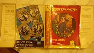 Immagine del venditore per Bronze Bell Mystery in RARE Color Dustjacket of 2 Girls, One Holding Candle Wearing Red Dress & a Boy in Blue Coat & Shorts Holding Candle in Eerie Room, Letter to Father Telling of an Inheritance Left By Uncle Caleb Thompson. Excited Children, Home in C venduto da Bluff Park Rare Books