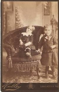 CABINET CARD PHOTO OF A TODDLER IN AN ELABORATE VICTORIAN CHAIR, AND A STANDING YOUNG BOY:; Handw...
