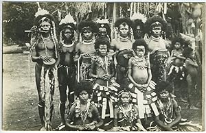 New Guinea men, women and children in ceremonial dress