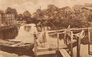 Wasserpartie am Mühlentor. Ansichtskarte in bräunlichem Lichtdruck. Abgestempelt Rostock 18.01.1921.