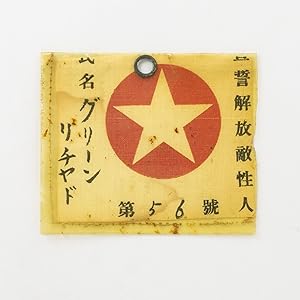 The identity tag or pass of one Richard Green, a prisoner-of-war of the Japanese during the Secon...