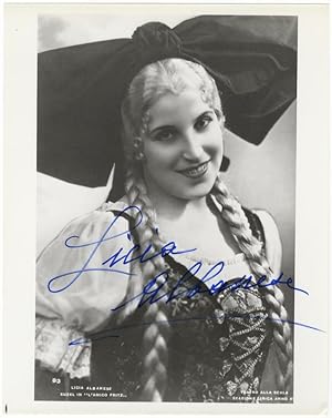 Role portrait photograph of the soprano as Suzel in Mascagni's L'Amico Fritz. Signed in full