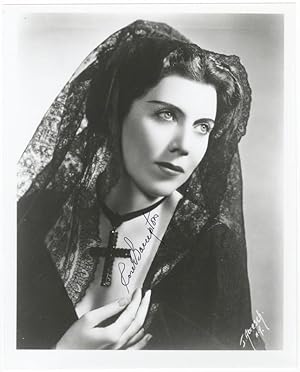 Role portrait photograph of the soprano as [?]Donna Anna in Mozart's Don Giovanni. Signed in full...