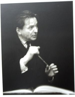 Immagine del venditore per A HANDSOME BLACK & WHITE PORTRAIT OF THE GREAT ROMANIAN COMPOSER & CONDUCTOR GEORGE ENESCU, BATON IN HAND, INTENSELY LOOKING UP FROM A SCORE venduto da Blue Mountain Books & Manuscripts, Ltd.