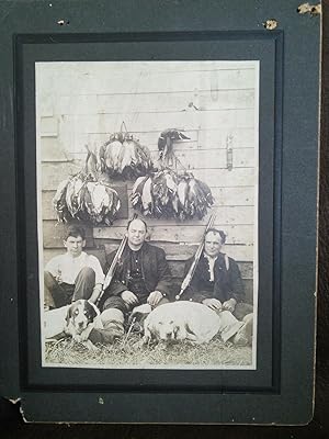 Vintage Photograph of 3 hunters with weapons, dogs and ducks