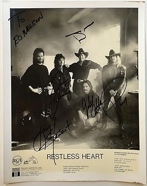 Promotional photographed signed by all five band members