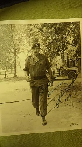 Seller image for Signed photograph John Wayne B/W ,8 1/2 x11 IN., Wayne is dressed in Army outfit with Jeep in Background for sale by Bluff Park Rare Books