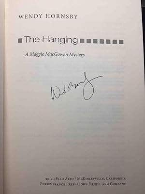 Bild des Verkufers fr THE HANGING: A Maggie MacGowen Mystery. zum Verkauf von Bookfever, IOBA  (Volk & Iiams)
