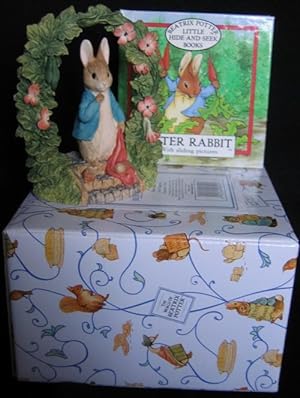 Grouping: " Peter Rabbit With Sliding Pictures" with "Peter Rabbit Arch Figurine" 3 1/2" figurine...