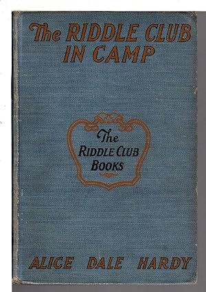 Seller image for THE RIDDLE CLUB IN CAMP: How They Journey to the Lake, What Happened Around the Campfire and How a Forgotten Name Was Recalled. for sale by Bookfever, IOBA  (Volk & Iiams)