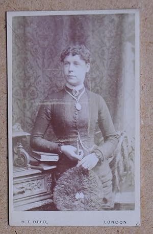 Seller image for Carte De Visite Photograph: Studio Portrait of a Young Woman with a Feather Fan. for sale by N. G. Lawrie Books