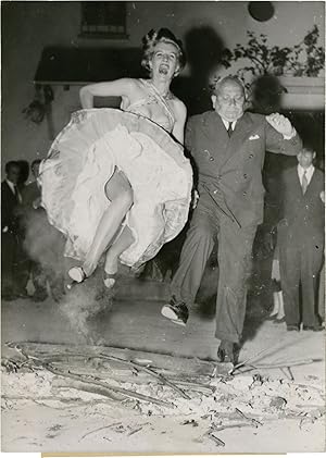 Photograph of director Erich von Stroheim and Corinne Calvet at a party for the release of "Les f...