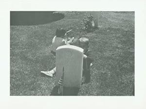 Imagen del vendedor de Black and White Photographic Print of two children playing behind gravestone of Lt. Col. Roy Harold Swanson US Air Force (1912-1961). a la venta por Wittenborn Art Books