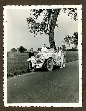 Germany, German Tourists posing with their car