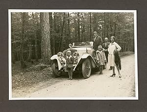 Germany, German Tourists posing with their car