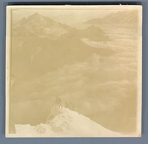 Bild des Verkufers fr Switzerland, View taken from the Matterhorn. Clouds covering the mountains zum Verkauf von photovintagefrance