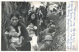 Vietnam, Women with children pass vietnamese infantrymen