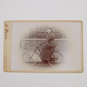 Cabinet card depicting a female cyclist.