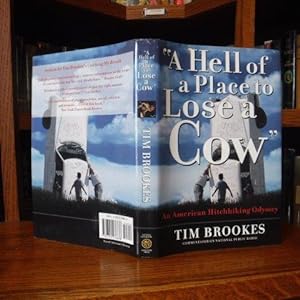 Seller image for Hell Of A Place To Lose A Cow: An American Hitchhiking Odyssey for sale by Old Scrolls Book Shop