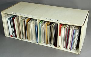 A collection of approximately 65 paper sample books in a custom cardboard Anchor Paper Company bo...